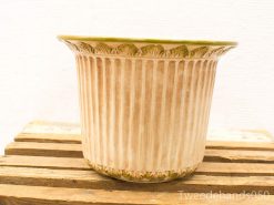 Elegant vintage ceramic flower pot with floral motif and earthy tones, perfect for rustic decor.