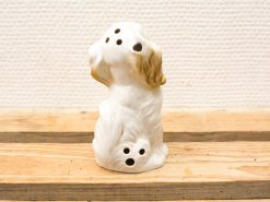 Charming ceramic dog figurine, detailed and glossy, ideal for home decor or incense use.