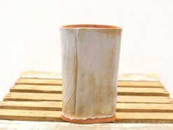 Elegant ceramic vase with natural textures and earthy accents, perfect for any decor style.