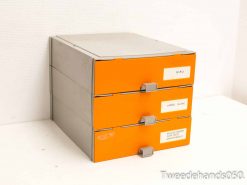 Modern orange filing cabinet with three drawers and a sleek gray top for office organization.