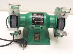 Compact green Craft TM-125 bench grinder for efficient tool sharpening and grinding tasks.