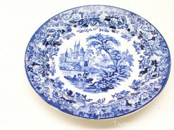 Elegant blue and white porcelain plate featuring a castle and floral design. Perfect for collectors.