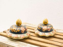 Vibrant blue and gold decorative containers with intricate designs and luxurious finishes.