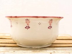 Elegant vintage ceramic bowl with hand-painted floral design, perfect for decor or serving.