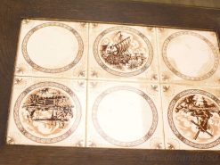 Vintage decorative tiles showcasing nature scenes, perfect for enhancing any interior decor.