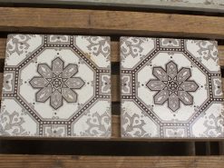 Elegant vintage tiles with star design, showcasing intricate craftsmanship and timeless charm.