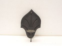 Elegant wrought iron wall candle holder with vintage charm, perfect for enhancing any living space.