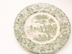 Vintage decorative plate with pastoral scene and floral border, perfect for home decor.