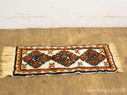 Vibrant vintage geometric rug with fringe, ideal for enhancing your interior decor.