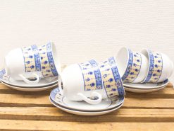 Elegant vintage blue and white ceramic cup and saucer set for afternoon tea.