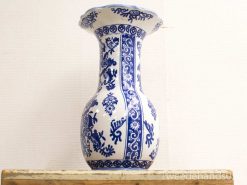 Elegant ceramic vase with intricate blue patterns, perfect for decoration or floral arrangements.