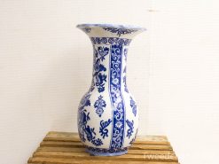 Elegant blue and white ceramic vase with intricate floral designs, perfect for any decor.