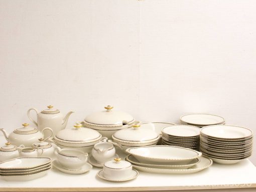 Elegant vintage fine china set with gold accents, perfect for formal dining and special occasions.