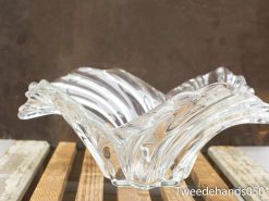 Elegant vintage glass bowl with a unique wavy design, perfect for serving or decoration.