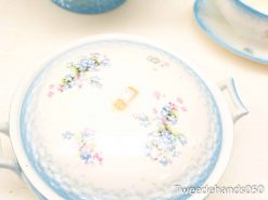 Elegant porcelain dish with floral design, perfect for dining and collecting.