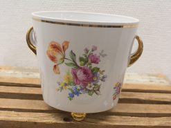 Elegant porcelain planter with floral design and gold accents for stylish home decor.