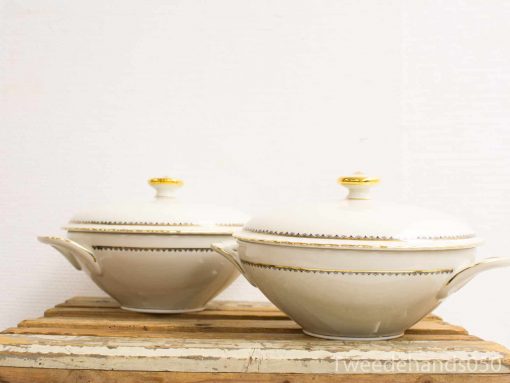 Elegant off-white porcelain serving bowls with gold accents, perfect for festive meals and gatherings.