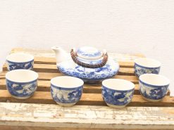 Elegant vintage tea set with blue and white motifs, perfect for intimate gatherings and tea enjoyment.