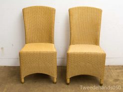 Elegant woven chairs with a timeless design, perfect for any indoor or outdoor space.