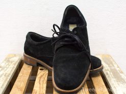 Stylish black suede shoes for versatile looks, featuring a timeless design and contrasting tan soles.