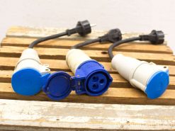 High-quality blue and white connectors for reliable high-voltage electrical connections outdoors.