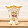 Elegant porcelain vase with hand-painted roses and gold accents, perfect for decorative display.