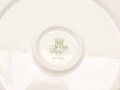 Vintage porcelain plate with German maker’s mark, elegant design for collectors of decorative art.