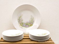 Elegant vintage dinnerware set with floral designs, perfect for special occasions and display.