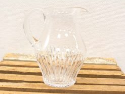 Elegant vintage glass pitcher, perfect for serving drinks or as a stylish home accent.