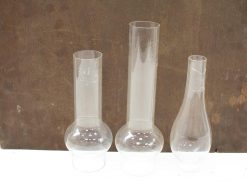 Elegant set of three glass vessels, perfect for decor or functional use.