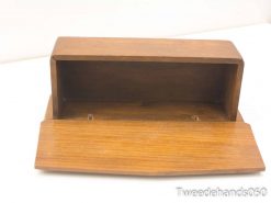 Handcrafted wooden box with elegant finish, perfect for storage and display of small items.