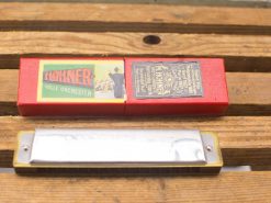 Vintage Hohner harmonica with elegant packaging, perfect for music lovers and collectors.