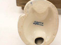 Vintage handpainted ceramic urinal showcasing artistry, functionality, and historical charm. Perfect for collectors!