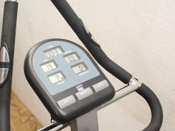 Modern home trainer display panel with workout stats: time, calories, speed, distance, and pulse.