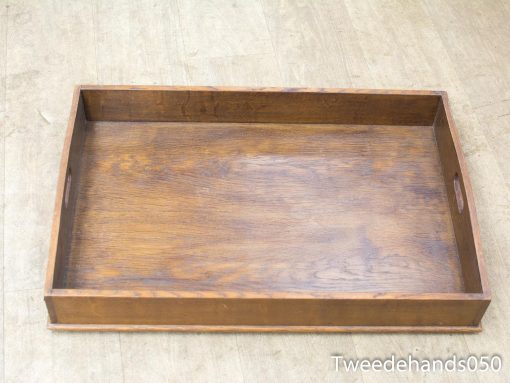 Elegant wooden tray with handles, perfect for serving snacks and drinks in style.