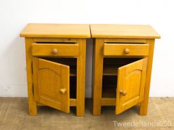 Light wood nightstands with drawers and storage, blending rustic charm with modern functionality.