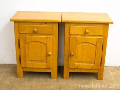 Vintage wooden nightstands with storage, perfect for complementing any bedroom decor.