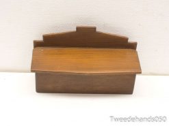 Elegant wooden storage box with vintage charm, perfect for organizing personal items.