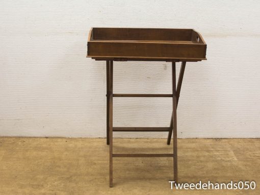 Elegant wooden tray table with metal stand, perfect for serving or displaying items.