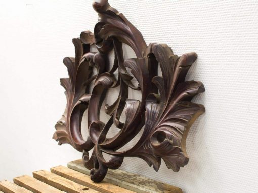 Exquisite wooden floral carving, ideal for vintage decor, adding warmth and character to any space.