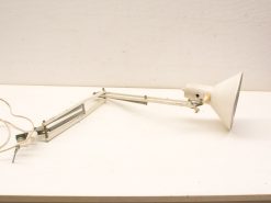 Adjustable white industrial desk lamp with sleek design, perfect for modern and traditional workspaces.