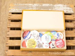 Colorful vintage buttons in an elegant box, ideal for collectors and creative projects.