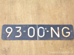 Vintage license plate 93-00-NG on weathered wood, evokes nostalgia and rustic charm.