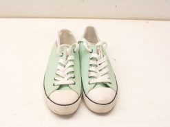 Stylish mint green sneakers with white laces, perfect for casual wear and daily adventures.