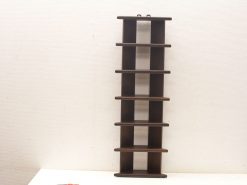 Sleek dark wood display shelf with minimalistic design and functional hooks for stylish organization.