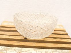 Elegant vintage glass bowl with intricate patterns, ideal for decorative displays or centerpieces.