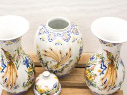 Charming antique ceramic vases with vibrant floral designs, perfect for elegant decor.