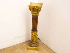 Elegant vintage column with intricate details and gilded accents, perfect for enhancing any space.