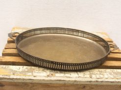 Elegant vintage serving tray with decorative perforated border and detailed handles, perfect for all occasions.