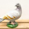 Charming vintage pigeon figurine in detailed gray and white, perfect for home decor.